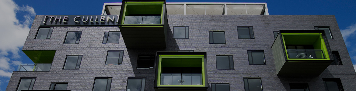 Grey building with protruding cubes